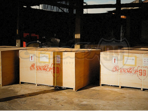 Scooter99 team building a custom wooden crate with padded protection
