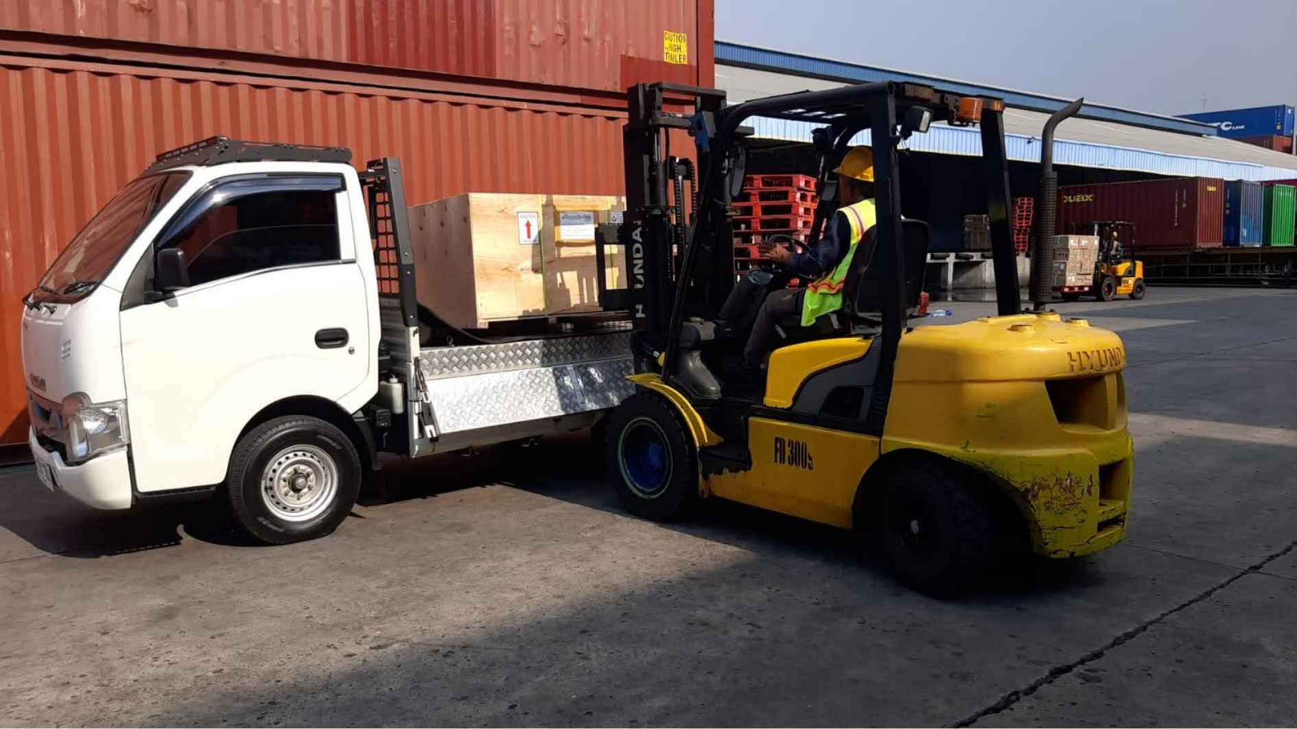 Customer opening Scooter99 crate on driveway in the USA