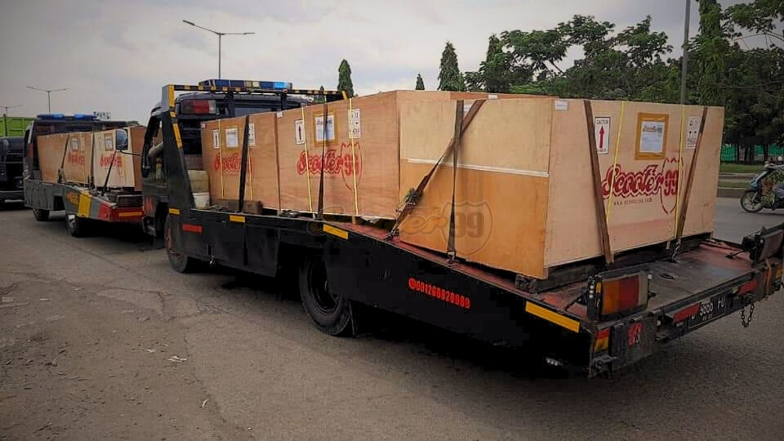 Loading custom crates into shipping container at the depot